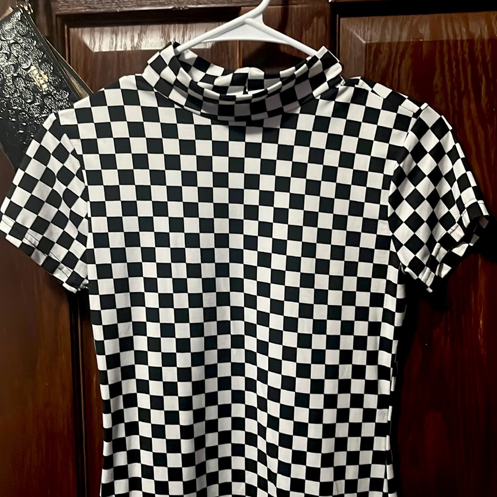 Checkered board turtle neck